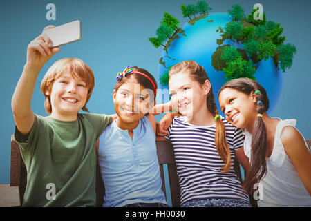 Composite image of happy children taking selfie at park Stock Photo