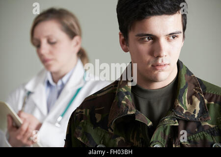 Soldier Being Assessed By Doctor Stock Photo