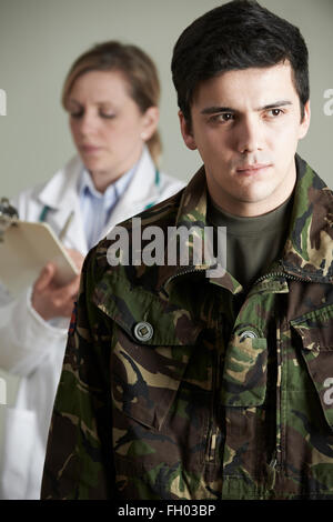 Soldier Being Assessed By Doctor Stock Photo