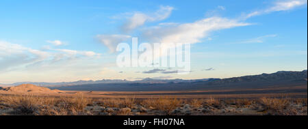 View of the Panamint valley near Death Vally, California. Valley just after sunrise    with long shadows under blue skies. Stock Photo