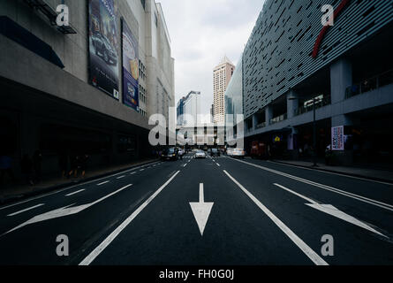 Arrows and modern buildings on Parkway Drive, at Ayala, in Makati, Metro Manila, The Philippines. Stock Photo
