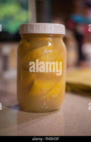 A jar of preserved lemons Stock Photo