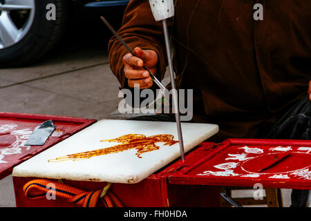 Chongqing, China - the view of traditional snack, sugar drawing. Stock Photo