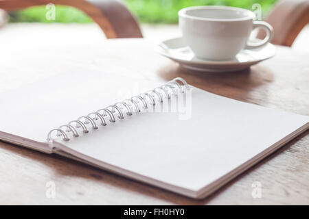 Open blank white notebook with cup of coffee, stock photo Stock Photo