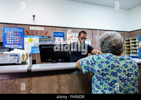 Florida,South,FL,Miami Beach,Washington Avenue,13th Street Post Office,interior inside,counter,clerk,customer,visitors travel traveling tour tourist t Stock Photo