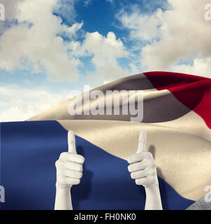 Composite image of businesswomans hands showing thumbs up Stock Photo