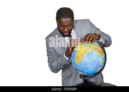 The globe in teacher's hands. Stock Photo