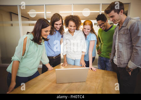 Business people looking at laptop Stock Photo