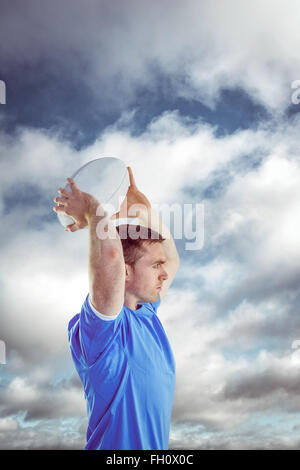 Composite image of disappointed rugby player holding his head Stock Photo