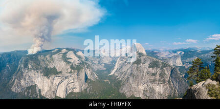 View from Glacier Point to the Yosemite Valley, forest fire with smoke, left Half Dome, Yosemite National Park, California, USA Stock Photo