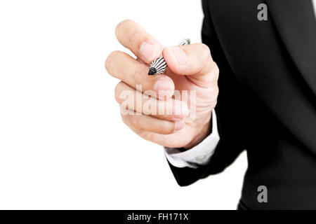 Businessman holding pen in writing position to screen, selective focus, isolated on white background Stock Photo