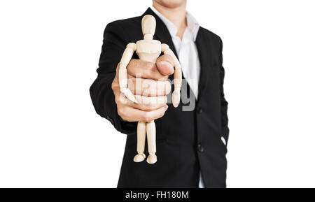 Businessman holding wooden figure, concept of take control, oppress, and etc., isolated on white background Stock Photo