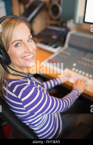 Happy young radio host in studio Stock Photo