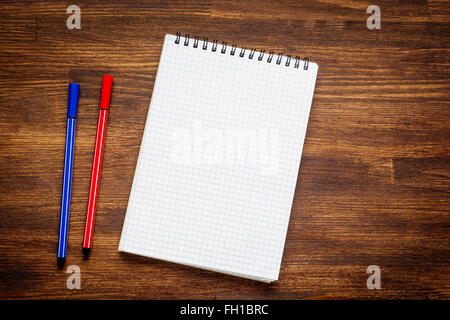 notebook and pen on wood table Stock Photo