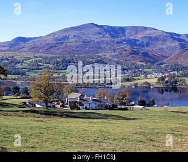 View over a farm and lake towards the mountains, Coniston Water, Lake District, Cumbria, England, UK, Western Europe. Stock Photo