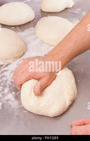 Baker prepares the dough bread and pizza Stock Photo