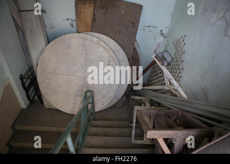 Old furniture and clutter causing an obstruction to the fire exit of a ...