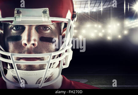 Composite image of american football player looking at camera Stock Photo