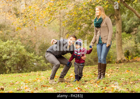 Young couple pointing something to their little boy Stock Photo
