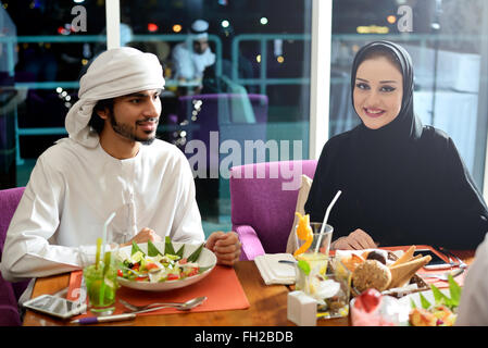 Young Emirati arab couple dining Stock Photo