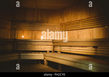 A sauna room with lit candles Stock Photo