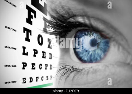 Composite image of blue eye on grey face Stock Photo