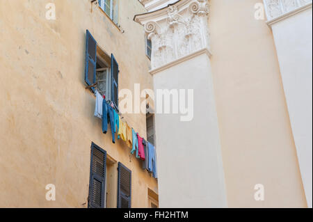 A washing line full of colourful clothes. Bastia.Corsica. France Stock Photo