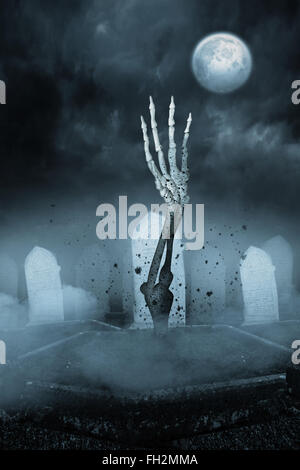 Zombie hand bursting from the grave Stock Photo - Alamy