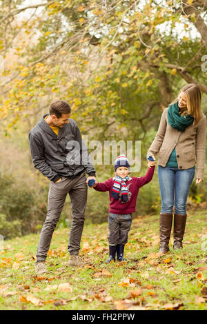 Smiling young couple looking their little boy Stock Photo