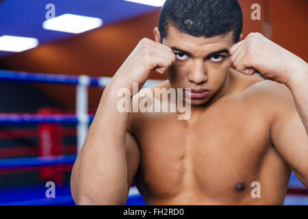 Portrait of a handsome male boxer workout in gym Stock Photo