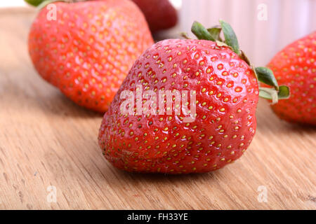Strawberry set on wooden plate close up Stock Photo