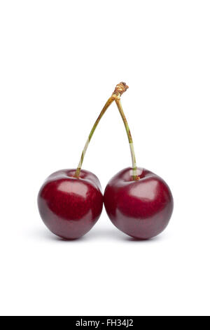 Red cherry twin on stalks on white background Stock Photo