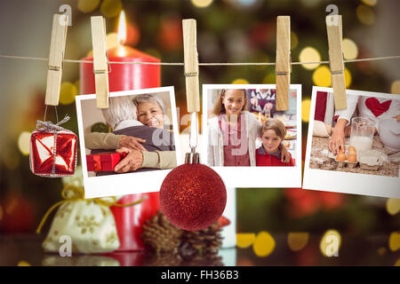 Composite image of hanging christmas photos Stock Photo