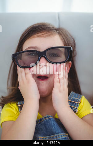 Close up of a girl wearing 3d glasses for a moive Stock Photo