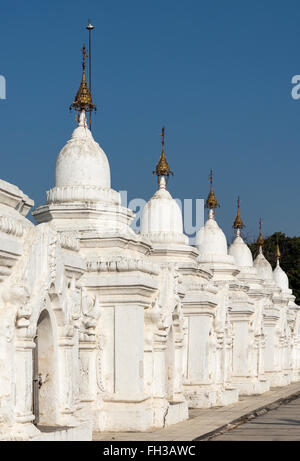 Row of whitewashed stone-inscription caves at Kuthodaw Pagoda in Mandalay, Burma (Myanmar) Stock Photo