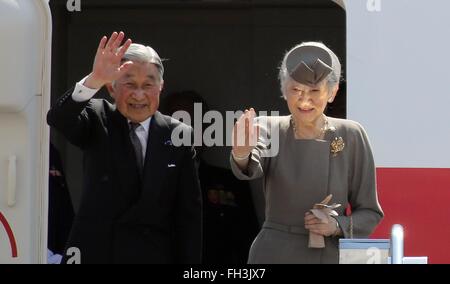 Japanese Emperor Akihito and his wife Empress Michiko wave as they board their aircraft following a five-day state visit to the Philippines at Manila International Airport January 30, 2016 in Manila, Philippines. Stock Photo