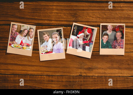 Composite image of instant photos on wooden floor Stock Photo