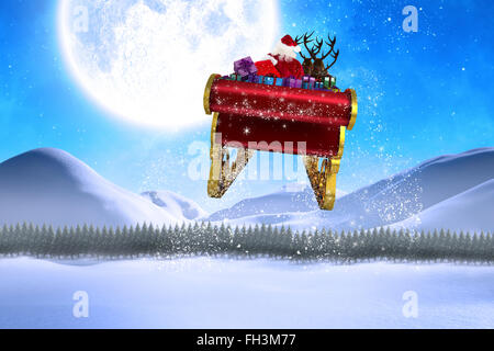 Composite image of santa flying his sleigh Stock Photo