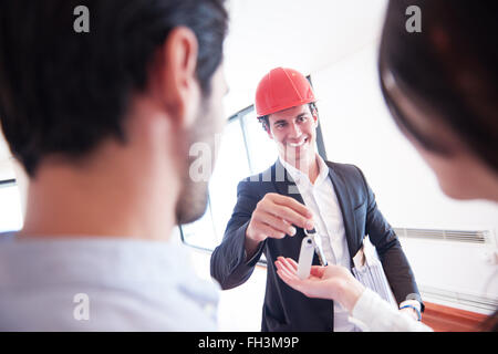 couple buying new home with real estate agent Stock Photo