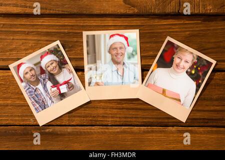 Composite image of instant photos on wooden floor Stock Photo