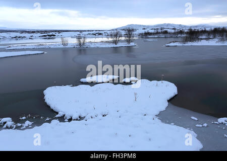 Winter snowy view over Pingvallavatn, the largest natural lake in Iceland, Pingvellir National Park, UNESCO World Heritage Site, Stock Photo