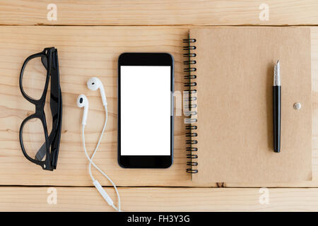 phone white screen on wood workspace top angle view Stock Photo