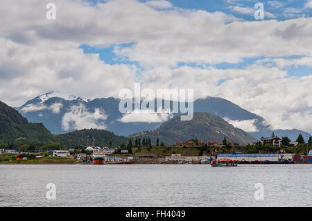 The boat from cruise ship Veendam sails to the dock of Port Puerto Chacabuco, Chile. Stock Photo