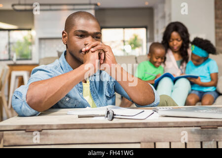 Man with bills and calculator Stock Photo