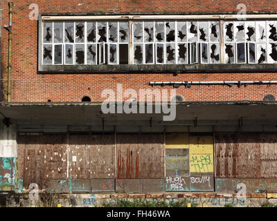 Boarded up abandoned industrial premises UK Stock Photo