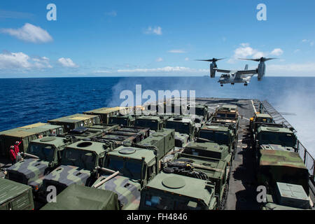 PACIFIC OCEAN (Feb. 19, 2016) An MV-22 Osprey lands on the flight deck of dock landing ship USS Harpers Ferry (LSD 49) during a sustainment exercise off the coast of Hawaii. More than 4,500 Sailors and Marines from Boxer Amphibious Ready Group and the 13th Marine Expeditionary Unit (13th MEU) are conducting sustainment training off the coast of Hawaii in preparation for entering the U.S. 5th and 7th Fleet areas of operations. Stock Photo