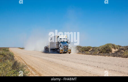 road train traversing the Strzelecki Desert on the Strzelecki Track with equiptment for the Moomba gas fields Stock Photo