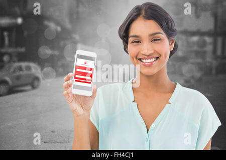 Composite image of businesswoman showing mobile phone over white backgroun Stock Photo