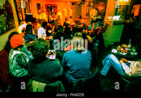 Paris, France - Crowd People from behind, tables, Jazz Club 'Sing-Sing', Young Adults in Audience Listening to Music in Basement of the 'China Club' ('Le China') Restaurant, Vintage Stock Photo