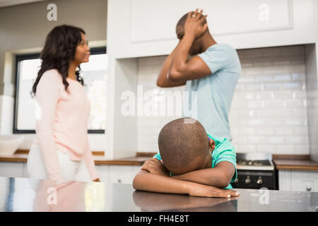 Mother and father arguing in the kitchen Stock Photo
